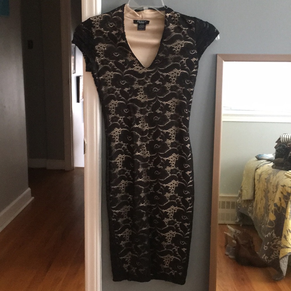Size small black lace fitted dress with nude liner